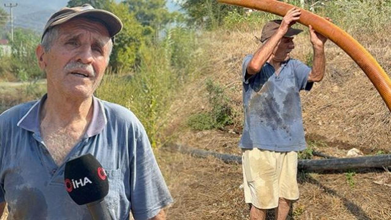 Zeytinlikleri kül olan kanser hastası Nazmi amca, kendi kurduğu sistemle yangına su taşıdı