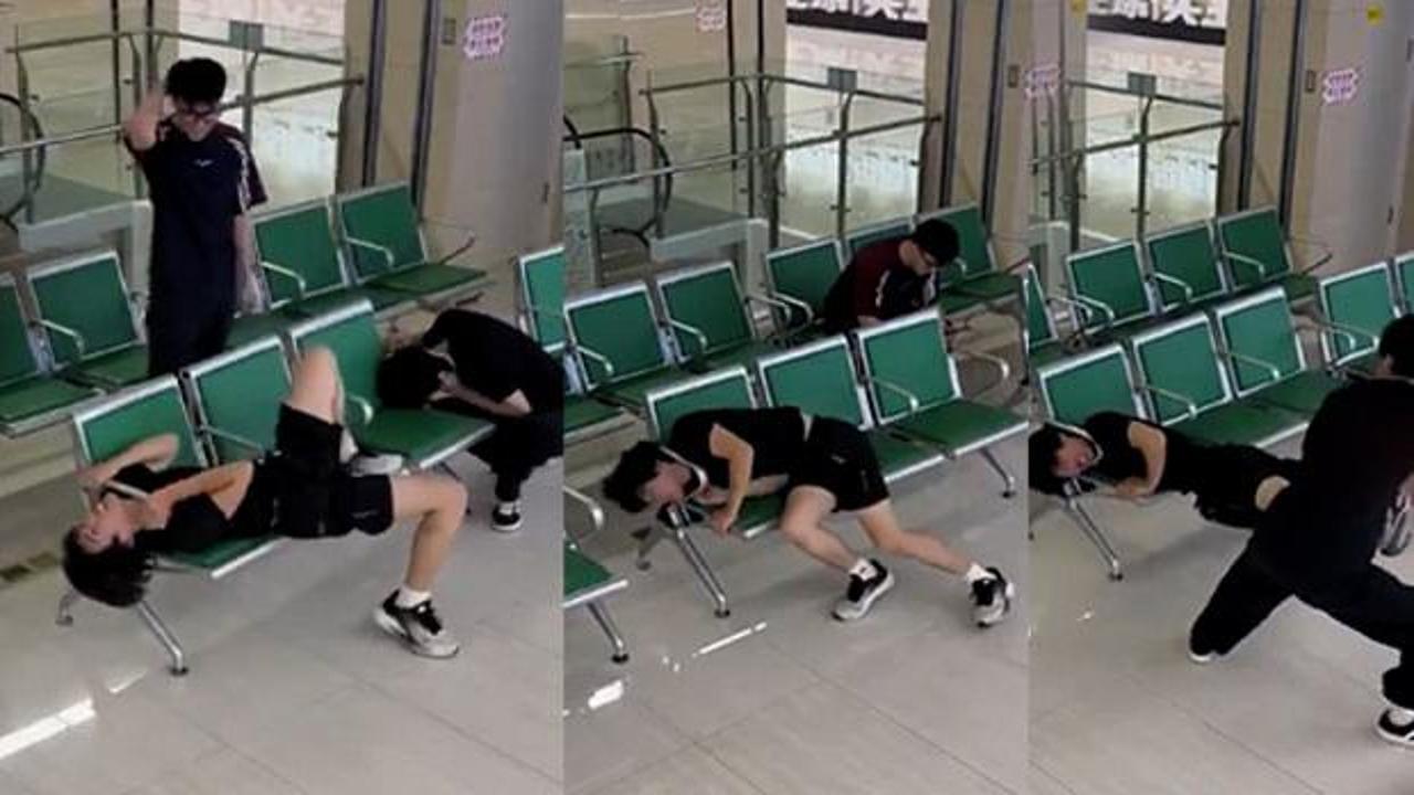 Çin'de ilginç anlar: Bekleme salonunda koltuğa kafası sıkışan gencin çaresiz mücadelesi